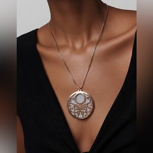 Rose gold tone necklace, likely stainless steel.
No tarnishing